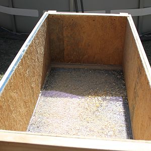 the brooder has a 1/4 in. wire floor at the bottom with a pull out tray for cleaning. Not sure about the wire floor because the poop still sticks to the wire. but i read it was not good for the chicks feet to be in the mess. BUT i see alot of brooder on byc with solid floors and shaving, so i really dont know.