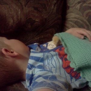 This is how my son fell asleep over the weekend with our smallest NH chick Peanut.