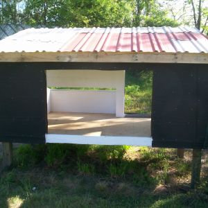 This view shows the double door opening for clean out. The roof is metal i had leftover from building my garage. the plywood inside and three of the outside walls they were going to throw away at work.