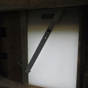 Detail of self latching coop door.