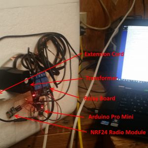 Outside of DIY incubator. Arduino Pro Mini, NRF24L radio module, relay board, old cell phone wall wart to supply everything but the light bulb. The extension cord powers the whole system.