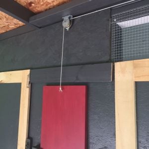 Pulley system for chicken door