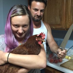 "Demi" posing with my husband and daughter. She's back in the coop