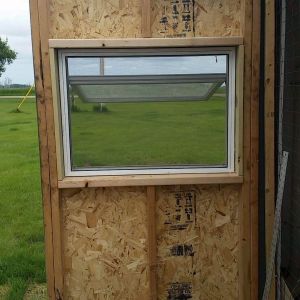 Here is the window I added in the door! I removed the insulation and made the rough cut, framed it in, siliconed it, secured it, and done!