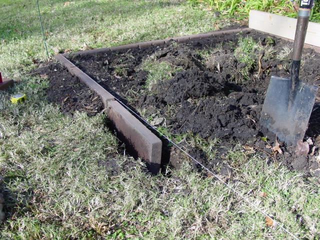 frame of coop sits on top of the horizontal pavers and weight of coop 