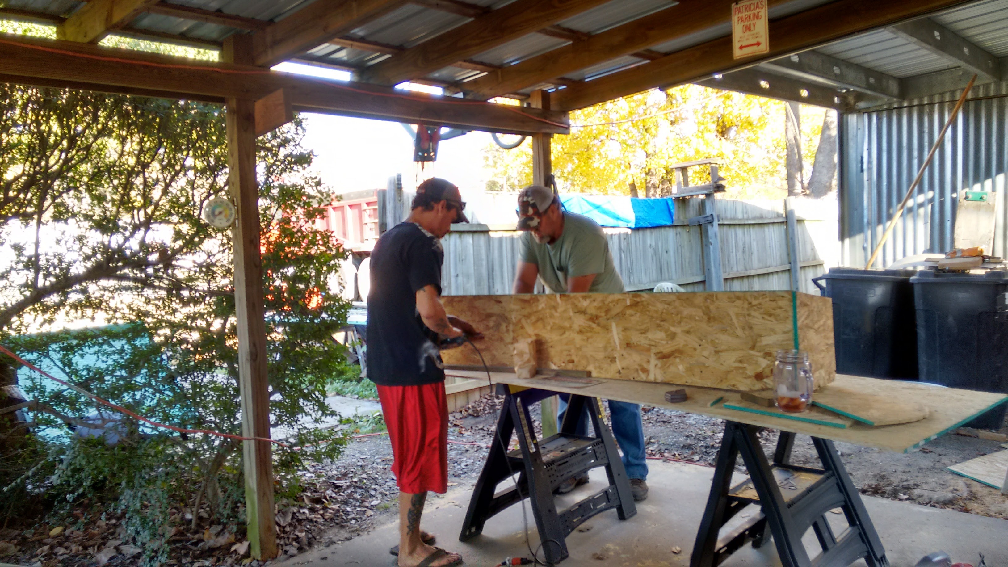 Dad and Son working on the bigger and better coop, hen house.