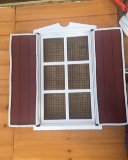 Window with shutters open. 1/2" vinyl coated hardware cloth covers all windows. Acrylic window panels can be inserted to cover the windows when the weather turns too cold.