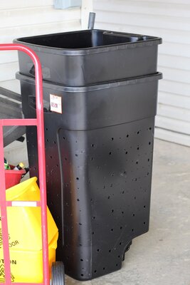 Drilled trash cans for garden.JPG