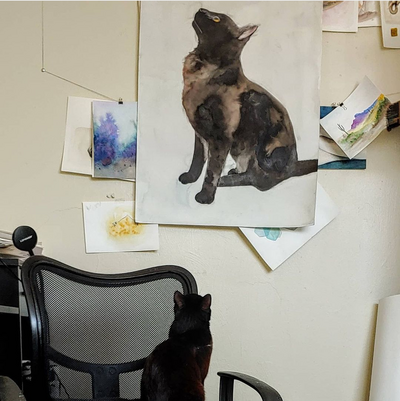 Rowdy critiques her portrait.png