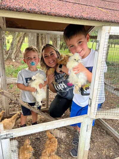 Kayla, Wyatt and Brody with the Silkie Bantams (June 2022).jpg