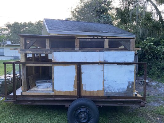 spot for door framed where hens enter and exit with  ventilation across top.jpeg