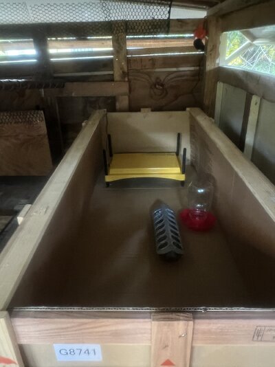 Brooder box with heat plate, eaterer, feed tray.jpg