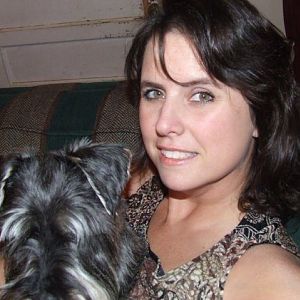 Myself and Ozzy, the Schnauzer.  He won't make eye contact with a camera.  Back when I had short hair and a tan.