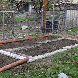 Foundation of buried cinder blocks donated by a coworker with pavers on top.
