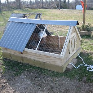 All done! You can see the ratty old tractor behind it. That one's going to the brush pile to be burned. We used Ondura roofing for the covered area to keep it nice and dry inside.