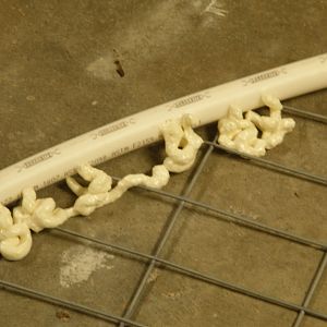 Foam fill holes used to bend over fence wire internally