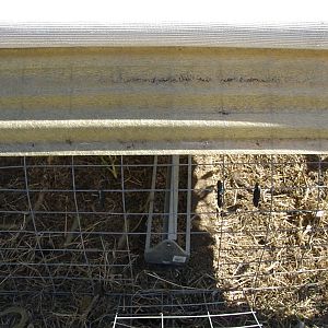 Feeding section with fiber glass cover, shade cloth and no wind fly