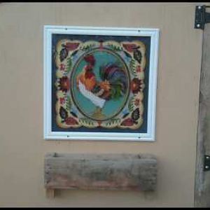 a stained glass picture a friend gave me and a part of a pallet I snagged from the scrap pile before hubby could burn it. makes a cute flower box