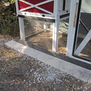 Replaced marble chips which wound up EVERYWHERE with concrete tiles. Let's see you
move those...oh God, I hope not!