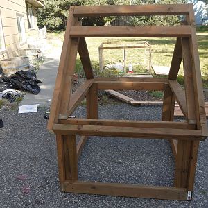 I added the second 2x4 on the side that would have the opening.  This board will allow me to anchor down the hinges.