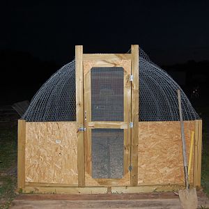 Door to the hoop house run