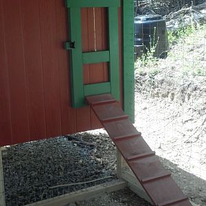 Guillotine door with ramp and you can see the compost bin in the background.