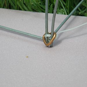 Hog ring at outside corners of arch and ends