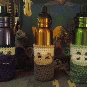 Monkey(or whatever you see) water bottle cozy ~ new design on its way to cover more of the bottle, but short ones available for regular cups.
$5 - 8 
$15 with water bottle
