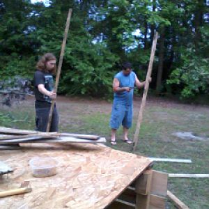 My son and my hubby ripping apart some of the pallets to use as supports for the fencing <3