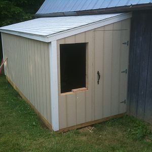 This is the front.  There's a people door and a window.  Bought some storm windows to use there.