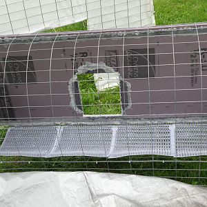 Interior of nest box with peck resistant foam board and nest pads
