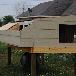 Almost done.  Right half of the nest box needs its hatched roof.  Window needs it's covering.  The roof needs to be finished and it needs lots of paint.