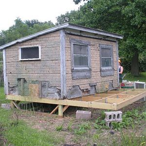 Here's the 6x12 building that sat in our back 40 acres rotting away.  Had to replace it's floor adn then we dragged it into our backyard.