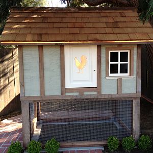 Copper ridge cap and copper trim, cedar shake roof. Front door is pulled off of 1940's built in cabinets.