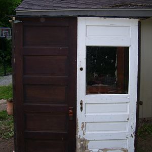 front of coop, left door opens. We r going to make a small opening in the right door for them so they can go in and out during the day, without leaving the big door open :)