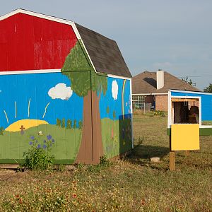 Moved coop by the Storage building that will make up 2 walls of the run.  I think they look good together.