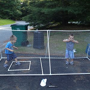 My twins goofing around inside while we were attaching the chicken wire! :)