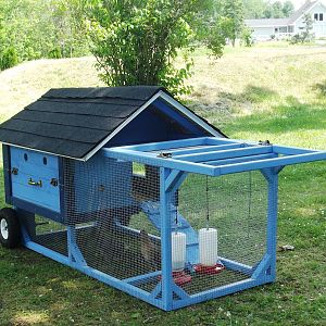 This coop/tractor was built for my MotherIn-Law. t holds 4 Banty's. Dimensions (approx) 
8' x 2 1/2' x 3'.