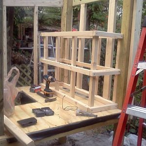 Standing the 2x2 frame walls up, we mounted the nest boxes directly to the frame.