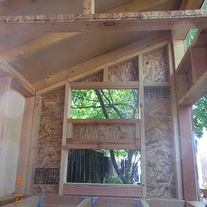 This is the inside of the coop.  Your looking at the nesting box (bottom) and vent.  There will be two large doors.  One on the inside of the run, and one where I'm taking the picture. The inside of the coop will also be insulated.