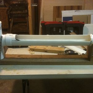 12. I failed to get pictures of the bottom and cradle as I was building this but it's really pretty simple. I just notched out 1¾" for the bottom of fill valve and screwed the cradle to the other end. It is held in place with plumbing strap. You can get a fitting at HD or Lowes to adapt the  toilet supply line to an outside spigot. Hook it up to a water supply.  How often you'll have to clean it depends on the number of chickens using it.