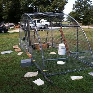 My Chicken Tractor for meaties and  a brooding pen.  Took a Trampoline frame and cut it in half, welded the bottom of the legs together and put in a metal lower frame and door.   lite enough for me to move by myself.