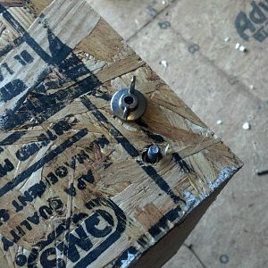 Lid is secured with four wing nuts. One at each corner