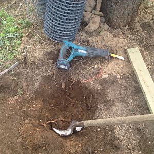 digging the last of the post holes, so all they are all on sitting on bedrock.