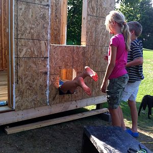 Jasmine showing the younger kids how the hens will enter the coop- hopefully the chickens will do it more gracefully