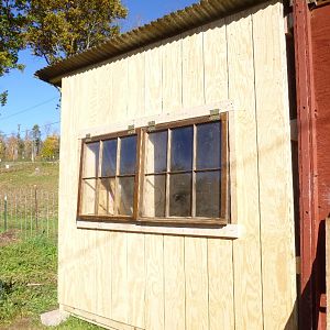 Step 19: Put windows on coop and frame them