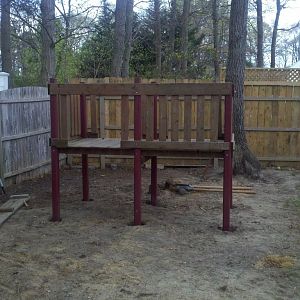 Kids old swingset,  dropped the legs down about 2 feet, poured concrete into holes to give it structure.