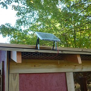 This is the solar panel for the automatic door.  Notice the vents under the roof.  There are vents under the nest boxes and around the sides too.  During the winter, the larger vents are covered with cut pieces of 2x6 boards with screws.  The screws can be backed out and the boards removed during the summer for air flow.