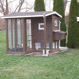 Finally done! Took about a month after getting the chickens to finish all of the trim work/painting/finishing touches. Put up some solar motion sensing security lights on the front and back sides for when we have to run out there at night, and hopefully to scare away any critters that might try to decide to take a closer look.