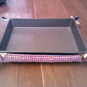 Red and white check withblue, yellow and red floral. Denim lining, butter yellow ribbons.